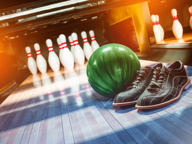 bowling. alley, ball, pins and shoes